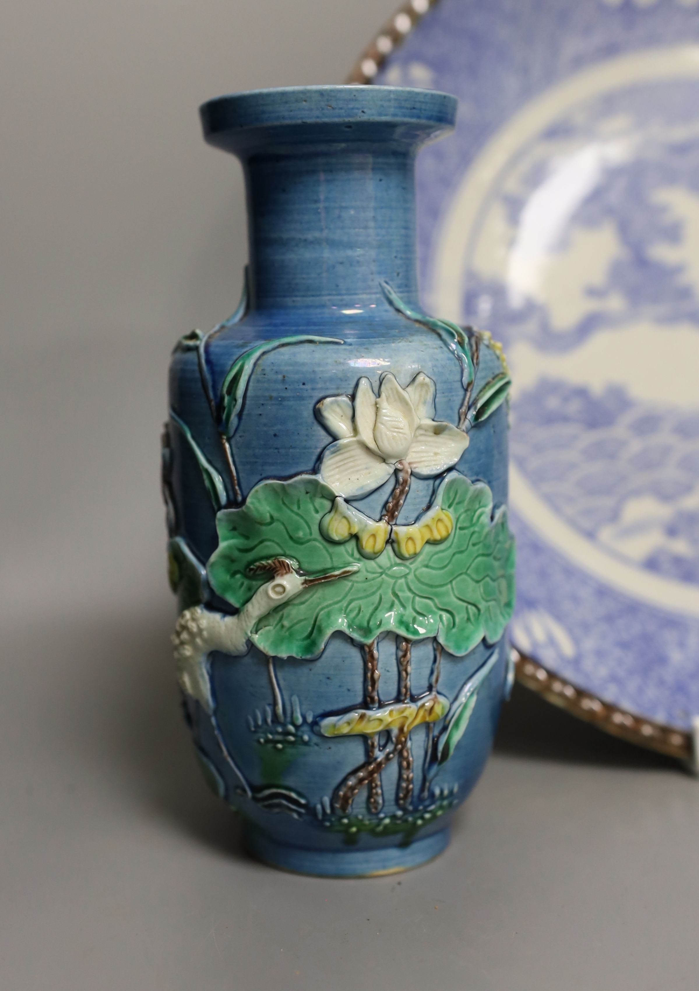 An early 20th century Chinese blue and white lidded vase together with a similar enamelled pottery vase and a Japanese blue and white dish. Tallest vase 29cm